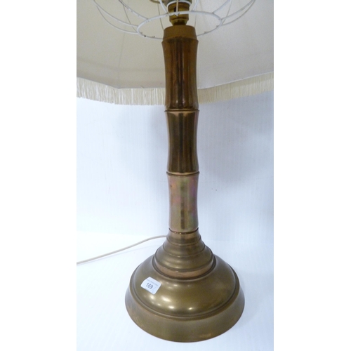 169 - Large modern brass-effect table lamp and shade, and another.  (2)