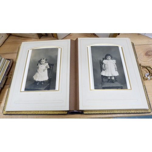 176 - Four Edwardian and later tooled photograph albums containing some contents.  (4)