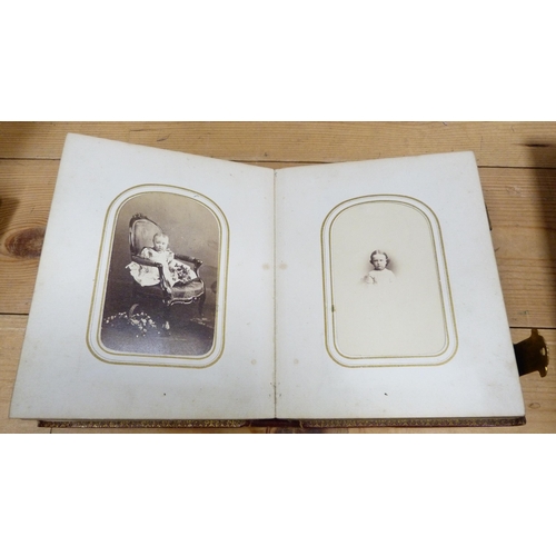 176 - Four Edwardian and later tooled photograph albums containing some contents.  (4)