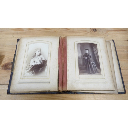 176 - Four Edwardian and later tooled photograph albums containing some contents.  (4)