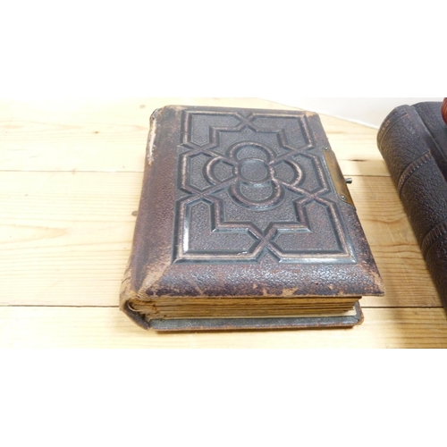 176 - Four Edwardian and later tooled photograph albums containing some contents.  (4)