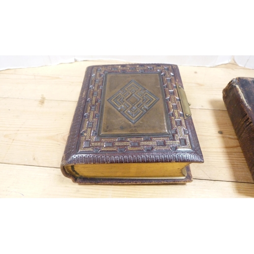 176 - Four Edwardian and later tooled photograph albums containing some contents.  (4)