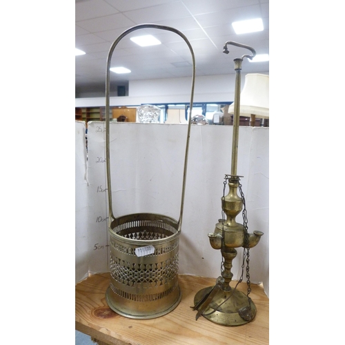 177 - Glass decanters, three whisky tumblers, Middle Eastern-style brass lamp and a bottle stand.