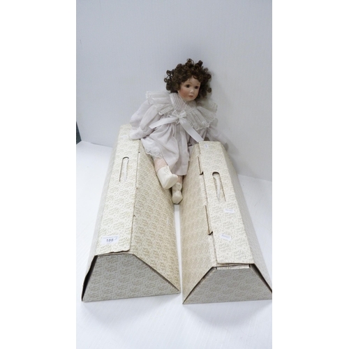 188 - Porcelain-head doll, two other boxed Heirloom dolls and an Imperial typewriter.