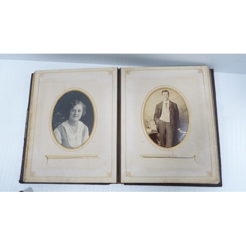 193 - Two Edwardian tooled photograph albums and contents.