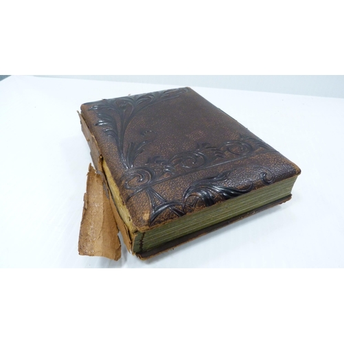 193 - Two Edwardian tooled photograph albums and contents.