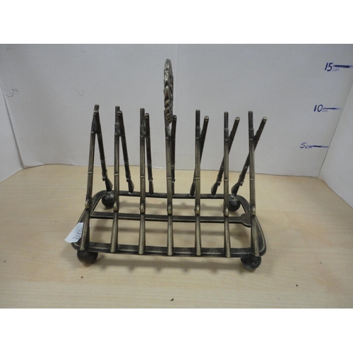 196 - Four-piece Picquot ware tea set, and a military interest toast rack in the form of rifles.