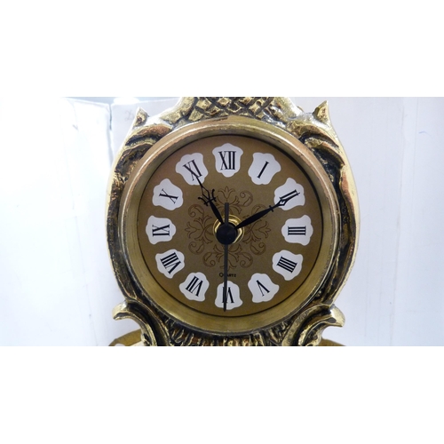 210 - Reproduction gilt metal mantel clock surmounted by a warrior on horseback.