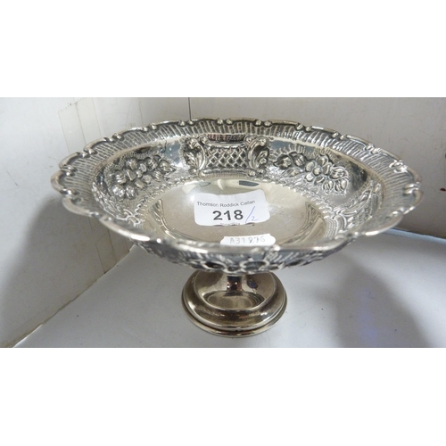 218 - Unmarked white metal embossed stemmed dish and a plated sweetmeat basket with blue glass liner. ... 