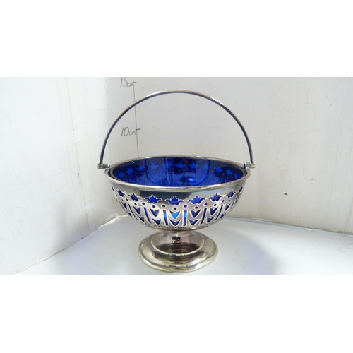 218 - Unmarked white metal embossed stemmed dish and a plated sweetmeat basket with blue glass liner. ... 