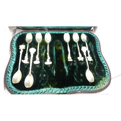 223 - Group of silver coffee spoons with assorted surmounts, cased.