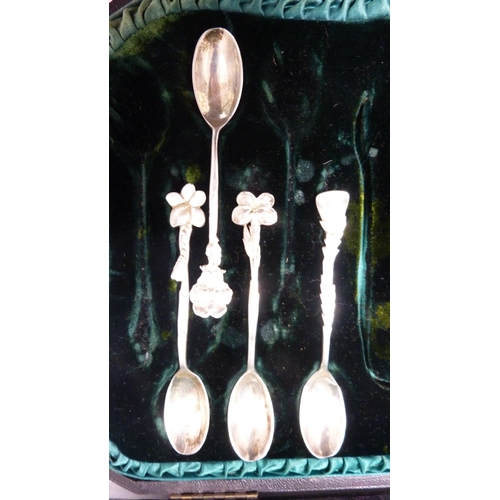 223 - Group of silver coffee spoons with assorted surmounts, cased.