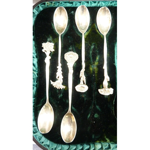 223 - Group of silver coffee spoons with assorted surmounts, cased.