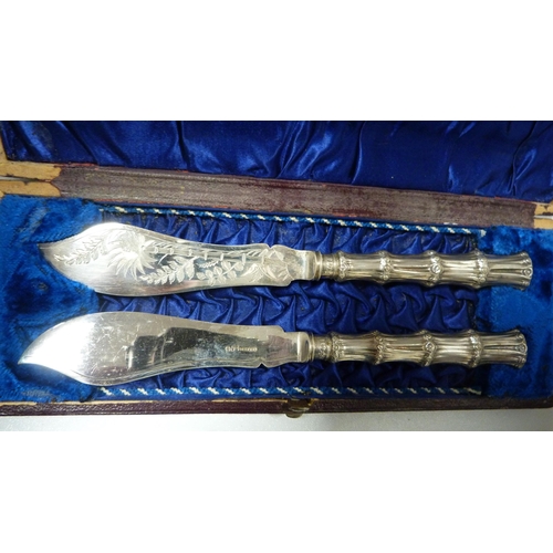 229 - Pair of silver sugar tongs, 50g approximately, and a pair of EP butter knives, cased.