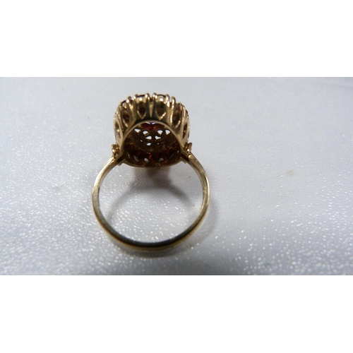 233 - 9ct gold lady's garnet cluster ring, 4.5g gross.