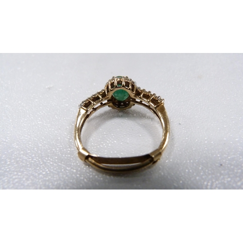 239 - 9ct gold emerald-coloured and diamond lady's dress ring, 2.3g gross.