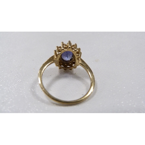 243 - 9ct gold tanzanite-coloured and diamond lady's cluster ring, 2.2g gross.