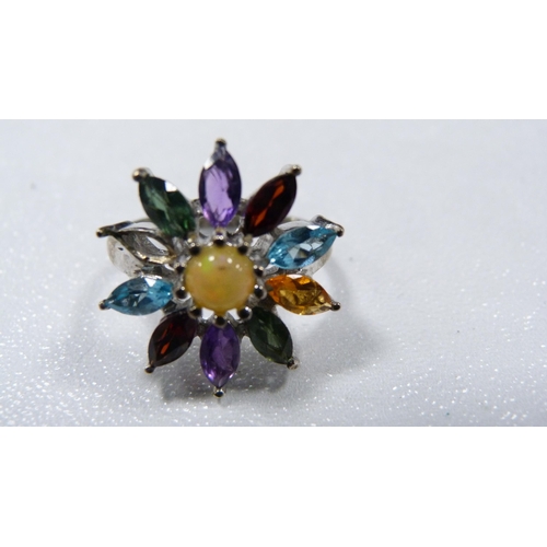 245 - Lady's silver flowerhead dress ring set with faux gemstones, and three pairs of yellow metal earring... 