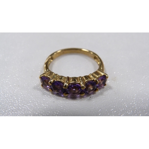 246 - 9ct gold tanzanite-coloured five-stone lady's ring, 3.1g gross.