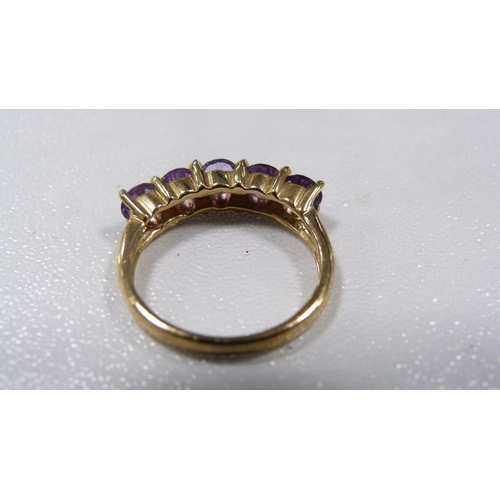 246 - 9ct gold tanzanite-coloured five-stone lady's ring, 3.1g gross.