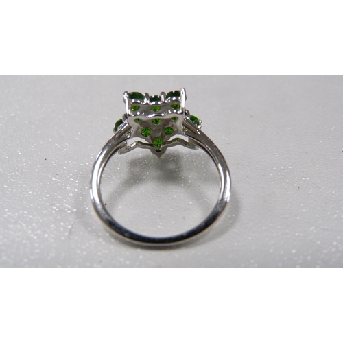 247 - 9ct white gold and emerald-coloured star-cut ring, 2.6g gross.