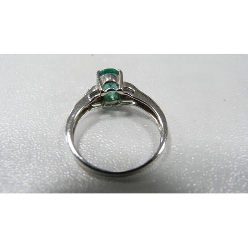 250 - 9ct white gold and emerald-coloured lady's solitaire ring, 2.7g gross.