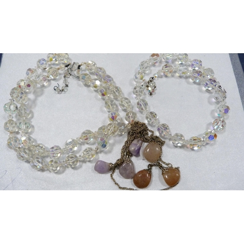 255 - Two glass bead necklaces and two pebble-set necklaces.  (4)