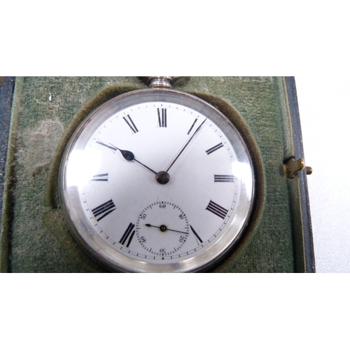 266 - Silver open face pocket watch in a silver-mounted travel case.