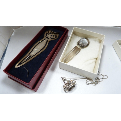 278 - Silver bookmark marked '925', another with mother of pearl surmount, 19g gross, and a white metal ci... 