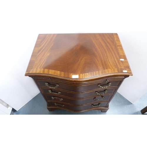 279 - Mahogany serpentine chest of drawers with brushing slide.