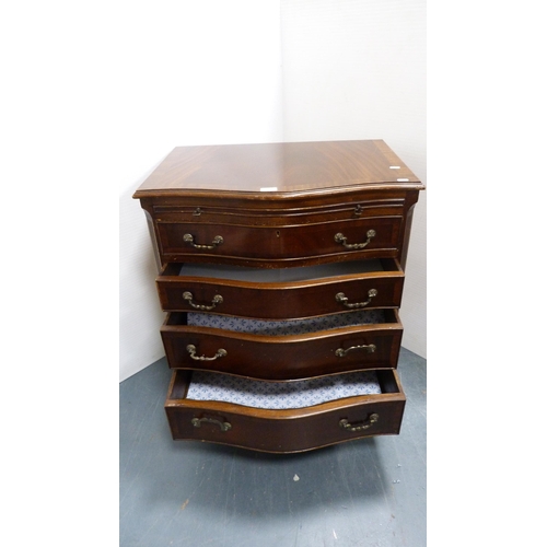 279 - Mahogany serpentine chest of drawers with brushing slide.