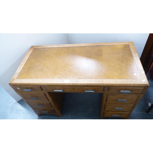 281 - Mid-century oak kneehole desk with tooled skiver to the top.