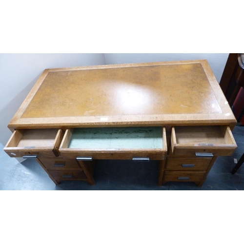 281 - Mid-century oak kneehole desk with tooled skiver to the top.