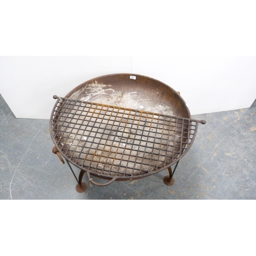 284 - Cast iron fire pit with grille.