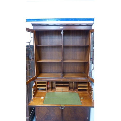 286 - Mahogany secretaire bookcase, glazed upper section with cupboard below.