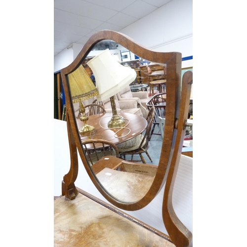 292 - Mahogany three-drawer bedroom chest and a mahogany shield-shaped dressing mirror.  (2)