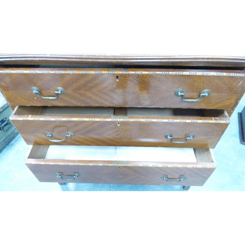 292 - Mahogany three-drawer bedroom chest and a mahogany shield-shaped dressing mirror.  (2)