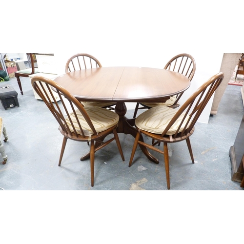 294 - Ercol circular table and four matching Ercol Windsor-style stick-back chairs.  (5)