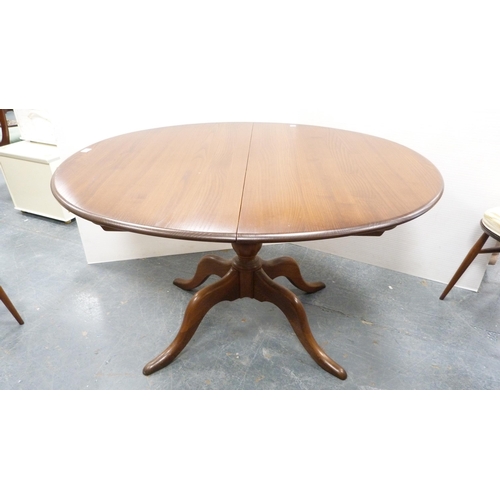 294 - Ercol circular table and four matching Ercol Windsor-style stick-back chairs.  (5)