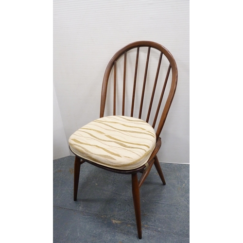 294 - Ercol circular table and four matching Ercol Windsor-style stick-back chairs.  (5)