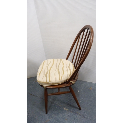 294 - Ercol circular table and four matching Ercol Windsor-style stick-back chairs.  (5)