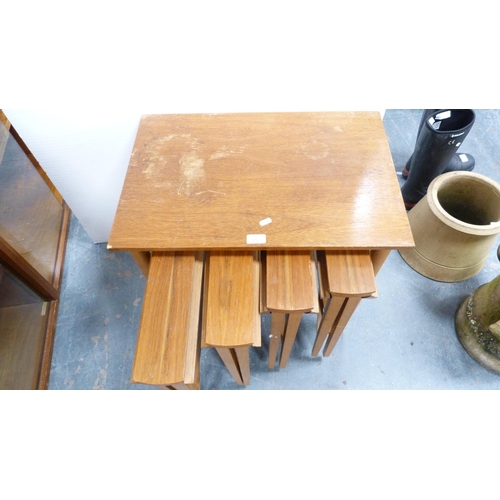 297 - Teak nest of five tables.