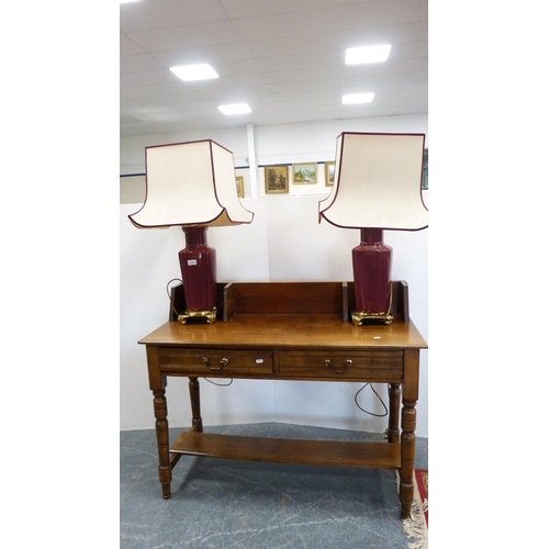 304 - Oak two-drawer side table and a pair of contemporary Chinese style flambé-coloured table lamps with ... 