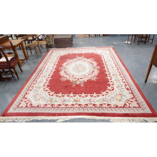 316 - Large Chinese-style carpet on red and cream ground.