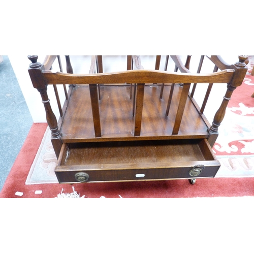 320 - Regency-style mahogany canterbury on brass castors.