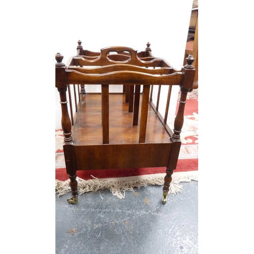 320 - Regency-style mahogany canterbury on brass castors.