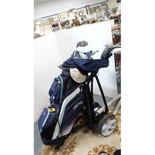 327 - Set of Ping golf clubs contained in a Ping bag, on an electric buggy, also other golf clubs, shoes a... 