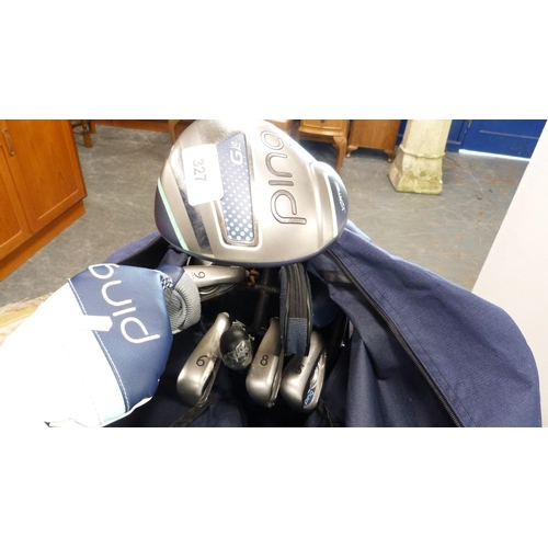 327 - Set of Ping golf clubs contained in a Ping bag, on an electric buggy, also other golf clubs, shoes a... 