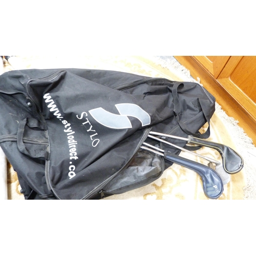 327 - Set of Ping golf clubs contained in a Ping bag, on an electric buggy, also other golf clubs, shoes a... 