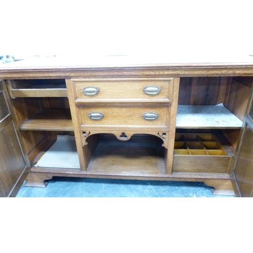 337 - Edwardian oak sideboard with cellarette drawer and assorted drawers and cupboards.